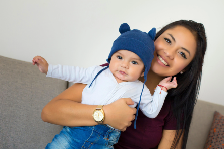 Young latino mom with his baby boy